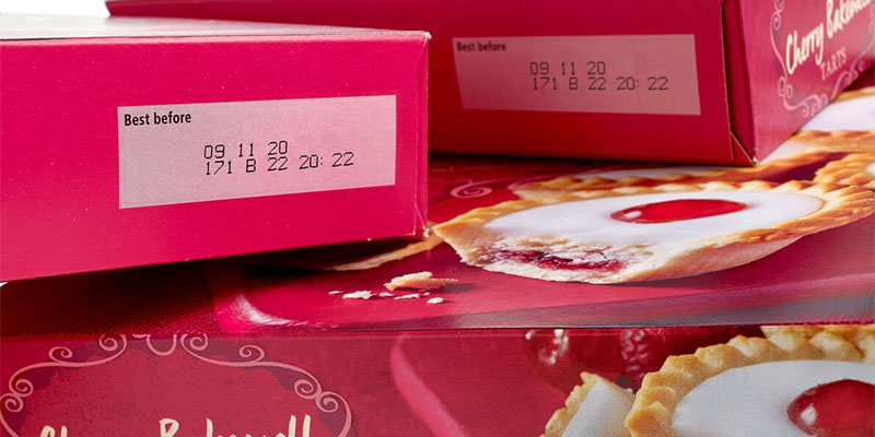 Best before date code on cardboard food packaging