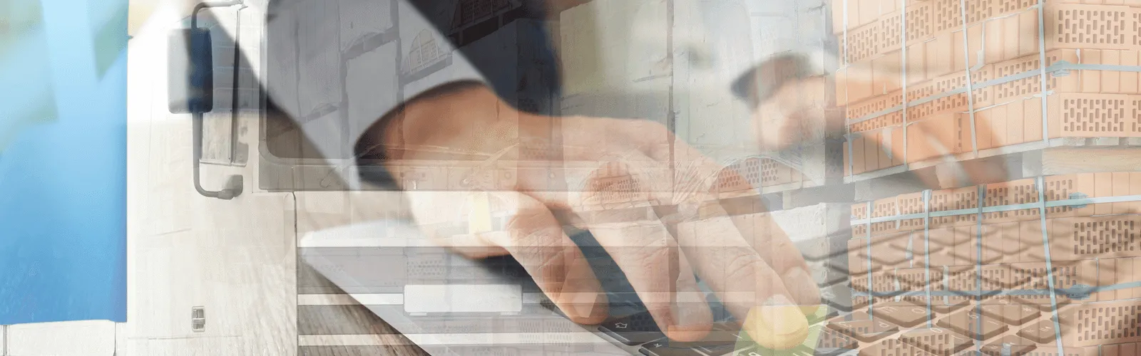 TLP hands typing blurred with palletised bricks 