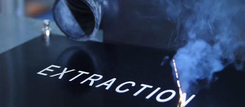 Laser coding with extraction