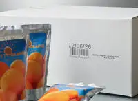 A white porous cardboard box with a Cx150i code printed on the outside, as well as some juice cartons.