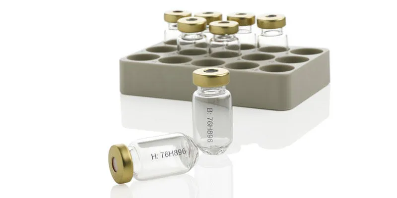 Black thermal inkjet code on clear glass vials