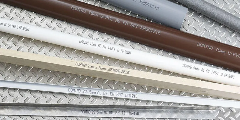 Domino's white and black continuous inkjet printer codes on metal and plastic extrusions